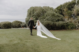 Couple walking over lawns