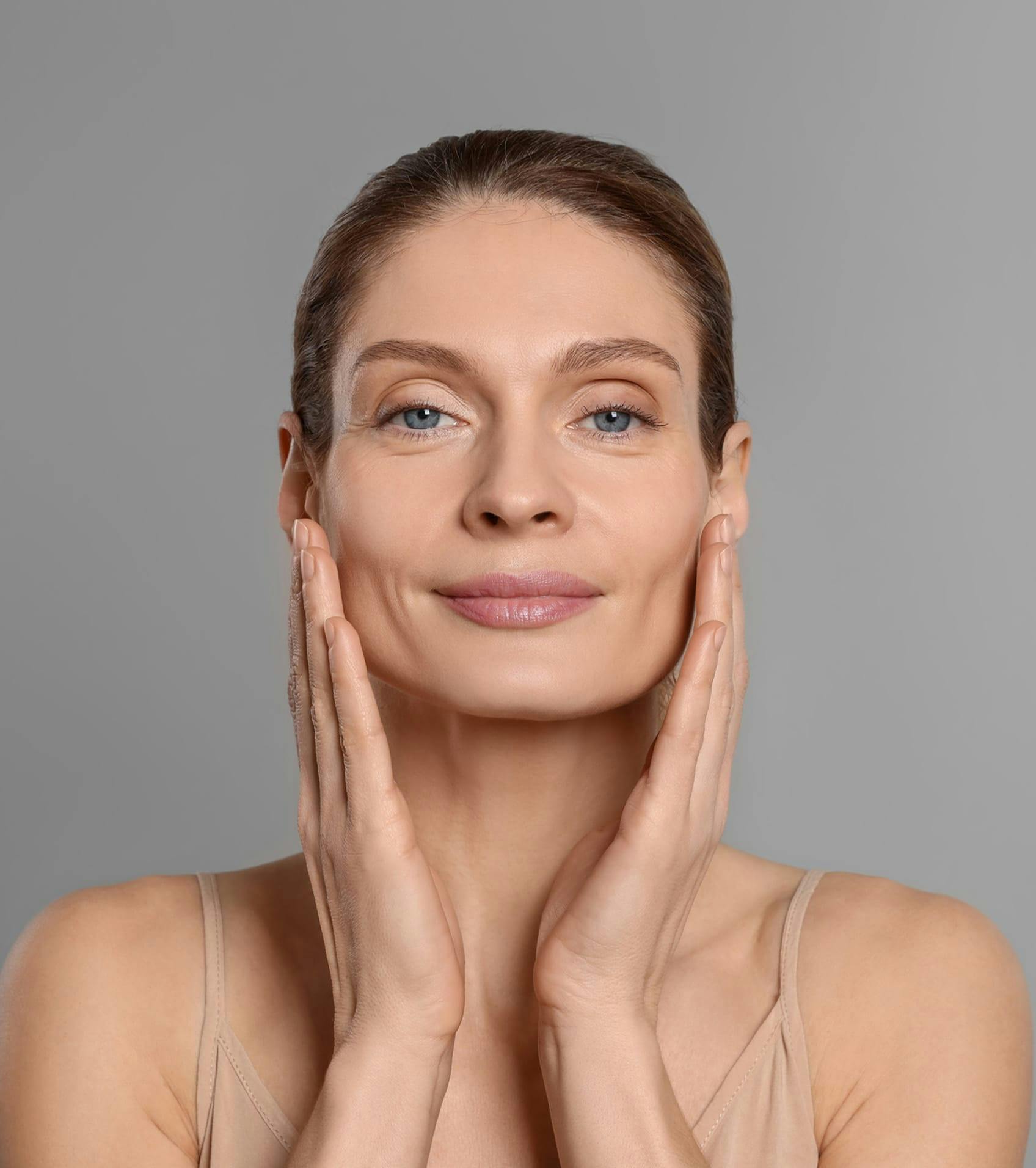 woman holding sides of face