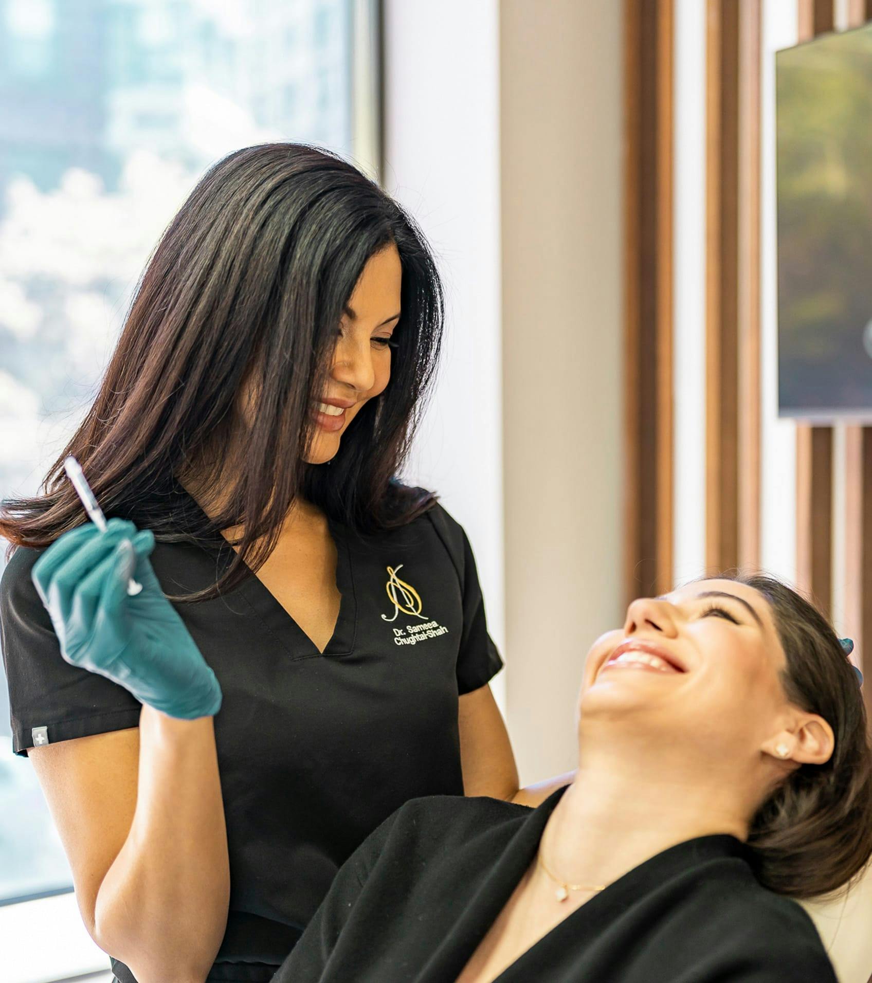 Dr. Chughtai giving a patient an injection