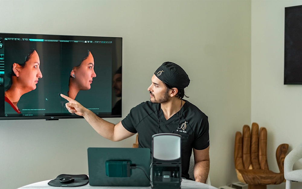 Dr. Shah pointing at a screen