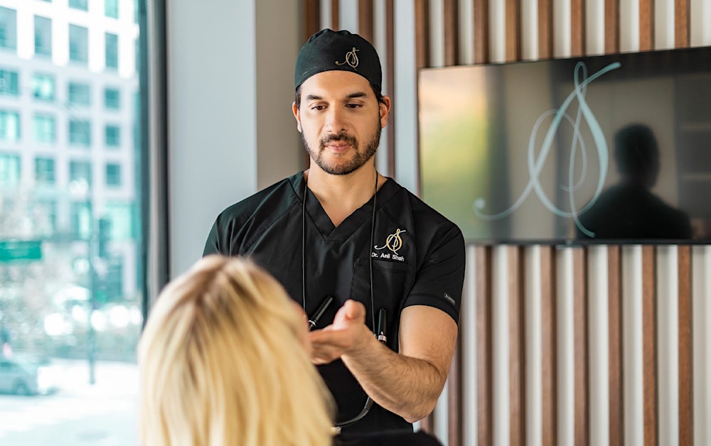 Dr. Shah looking at a patient
