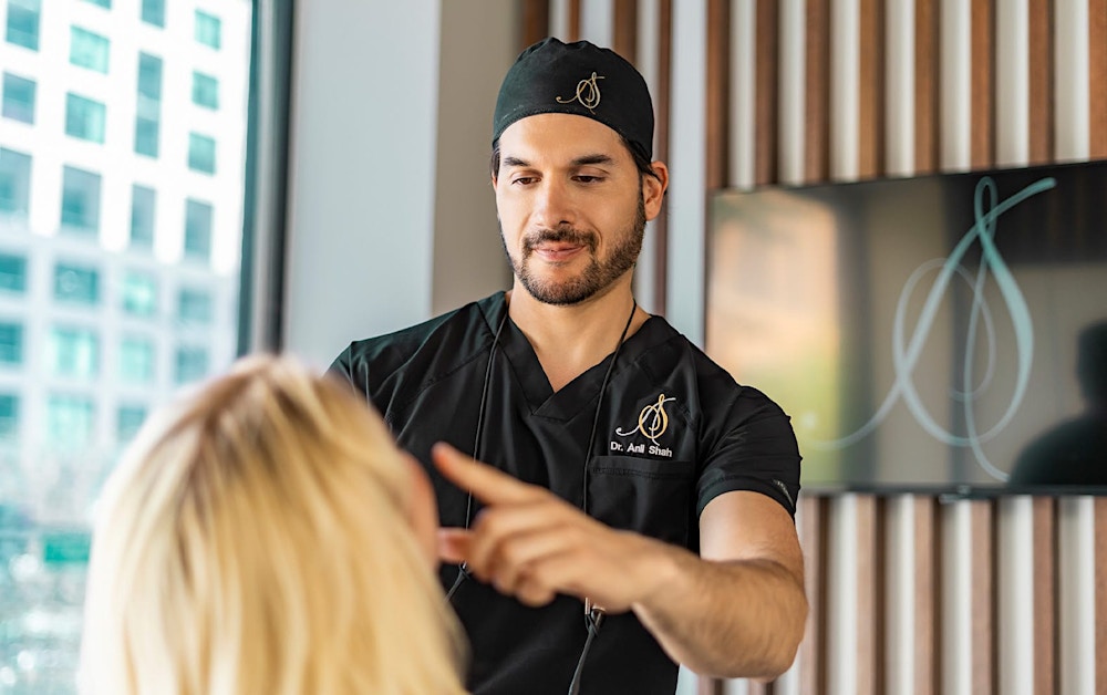Dr. Shah looking at a patient