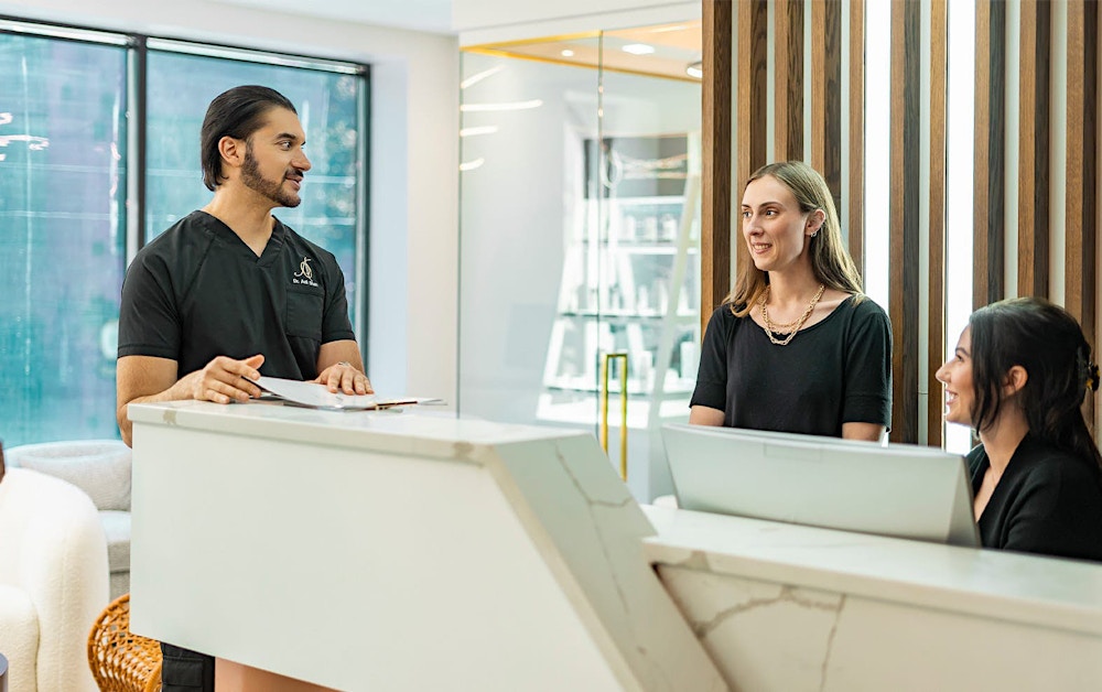 Dr. Shah talking to receptionists