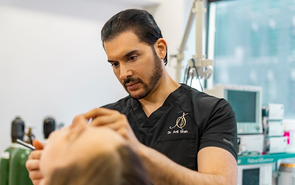 Dr. Shah working on a patient