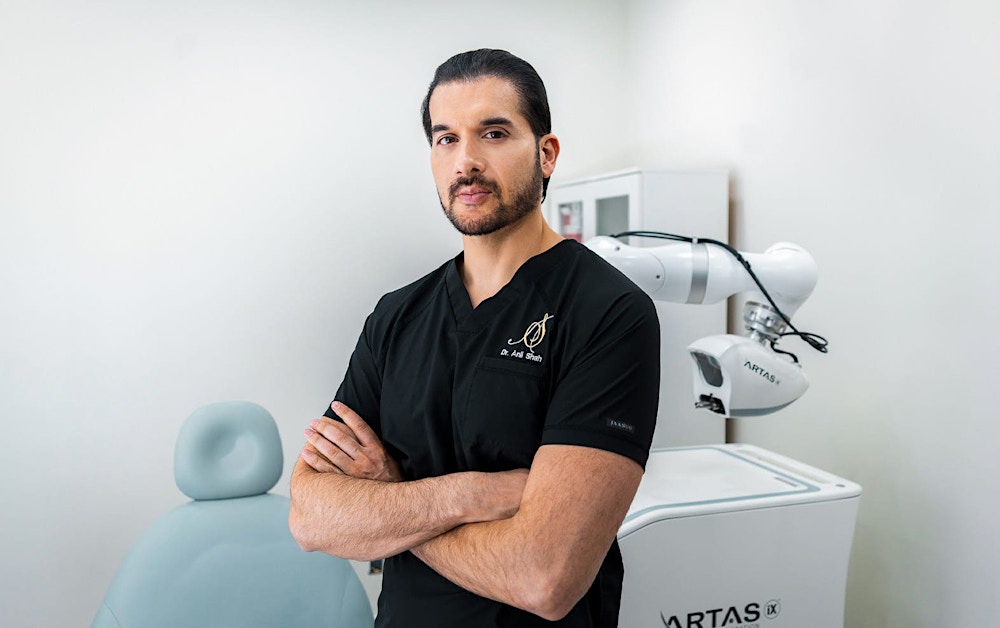 Dr. Shah crossing his arms