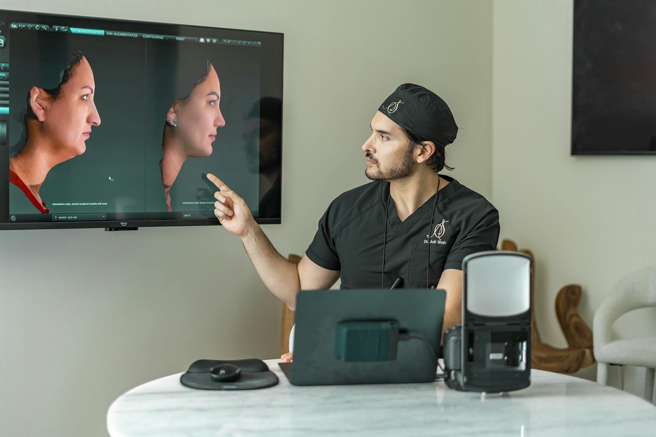Dr. Shah pointing to digital patient images on screen