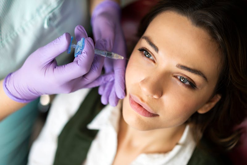 Woman receiving cosmetic injectable treatment