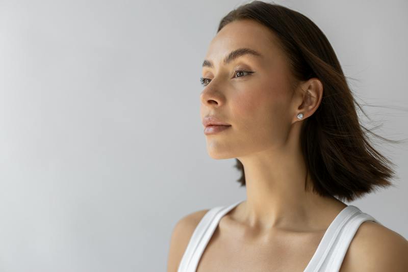 Woman shown in profile with a clear view of her nose and facial features