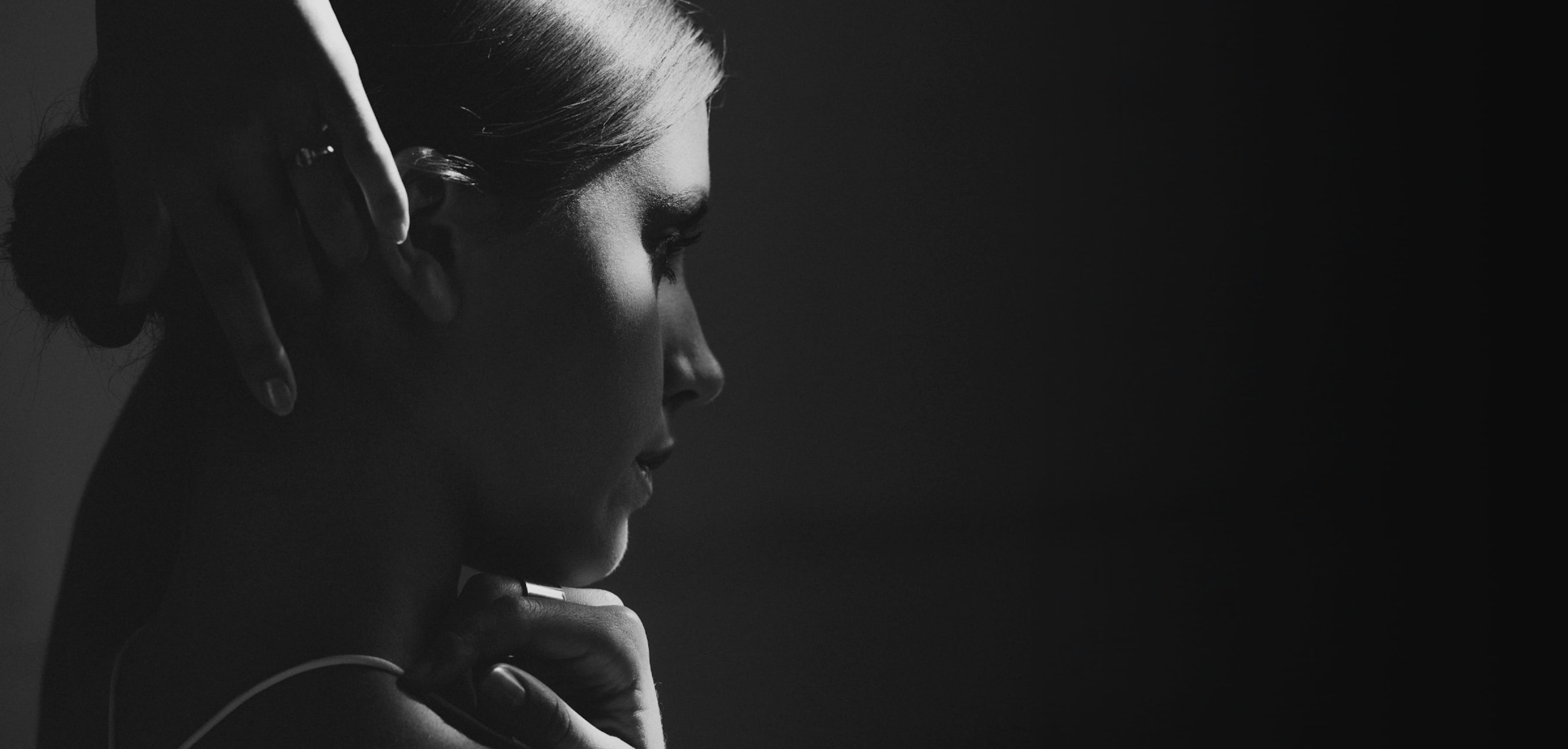 Black and white image of a woman in shadow