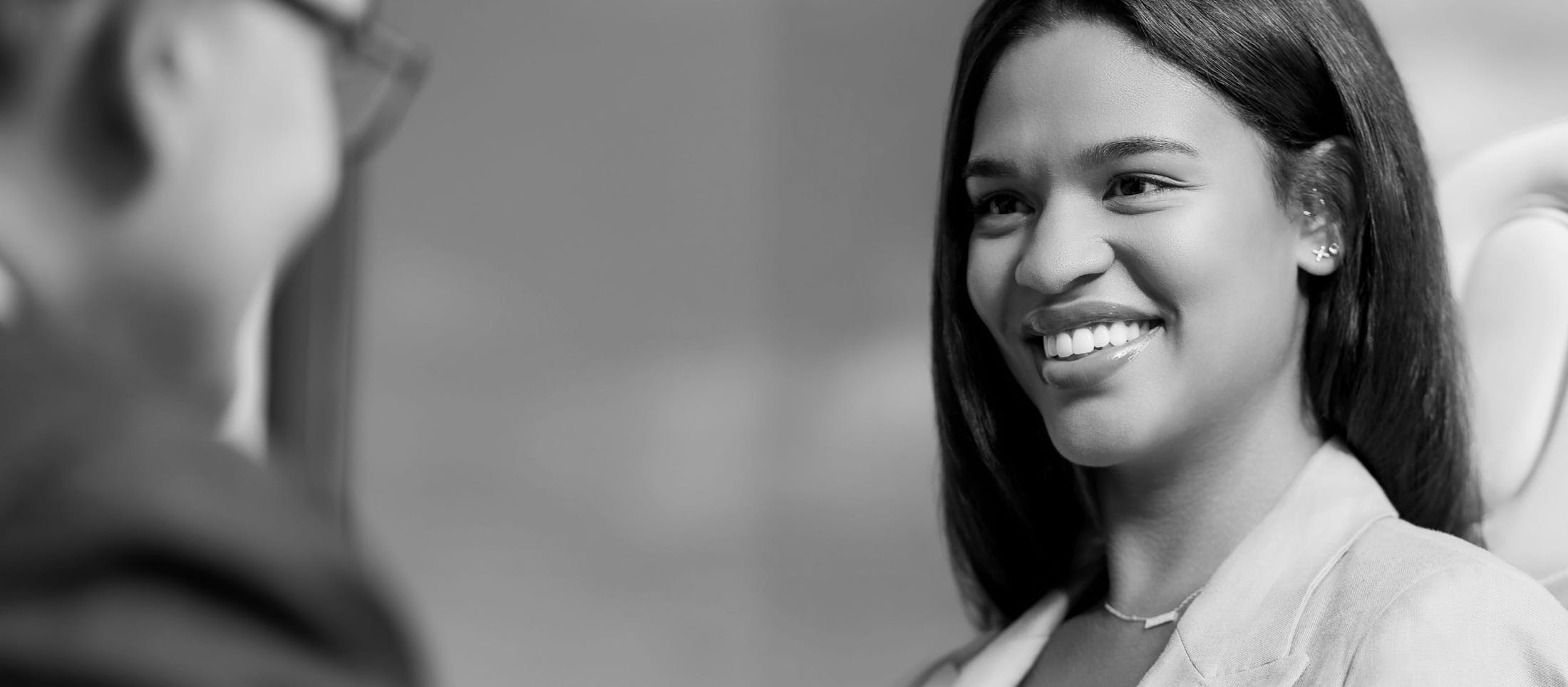 Woman with a necklace, smiling