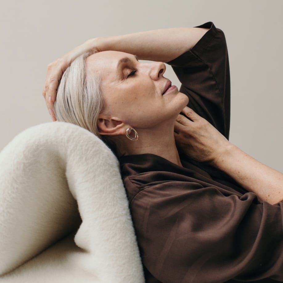 Woman with white hair lying down