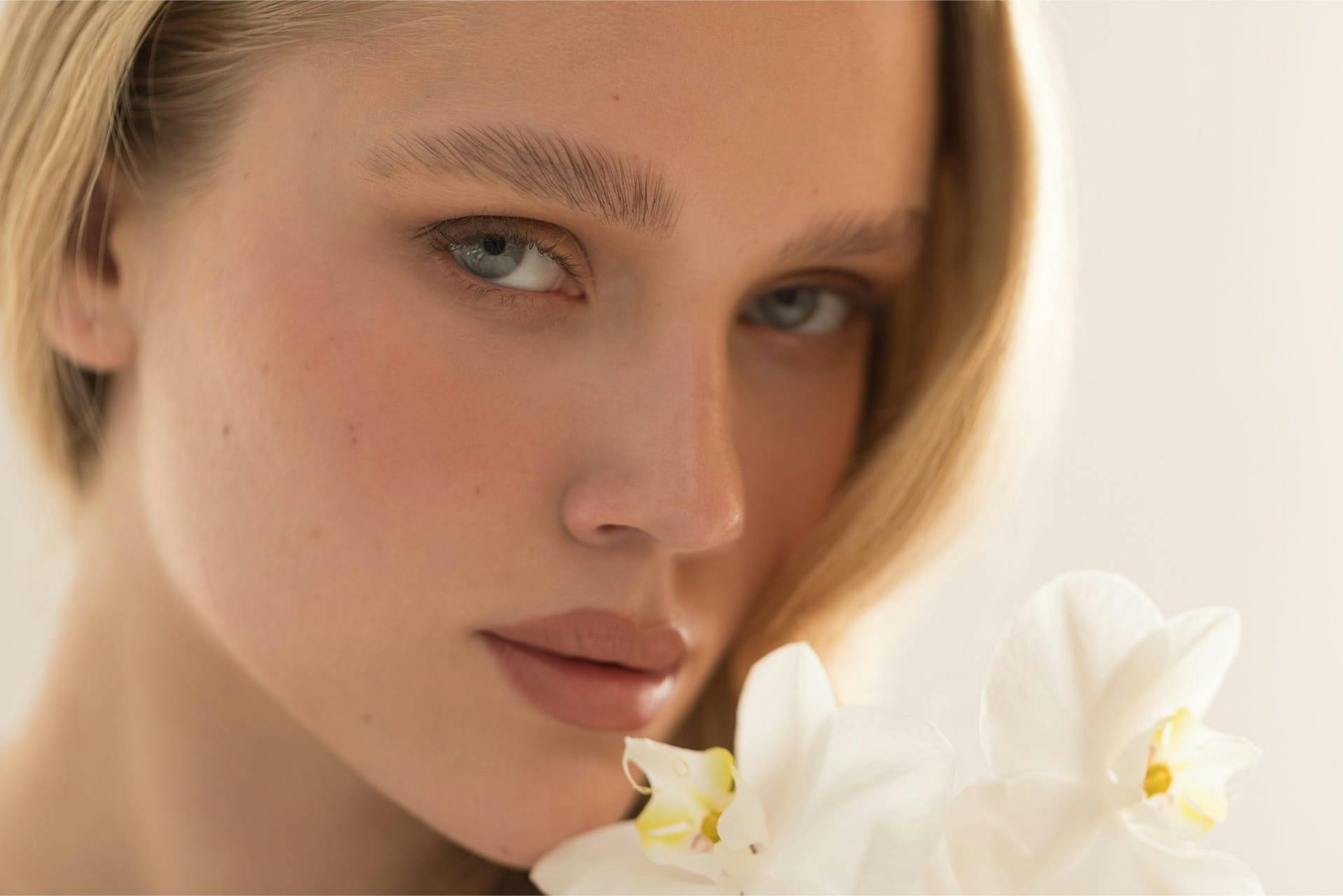 Woman smelling flowers