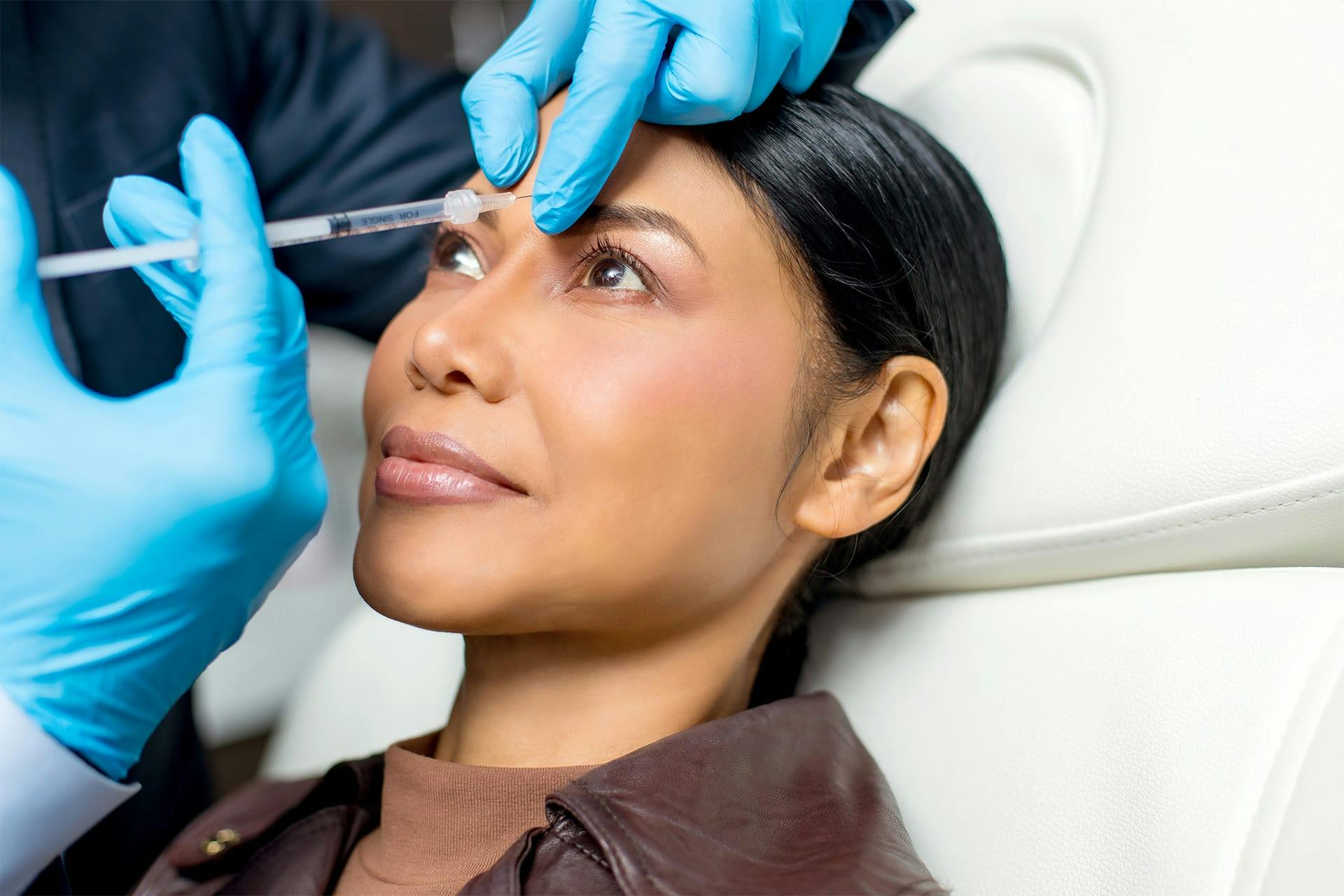 Woman receiving facial injection
