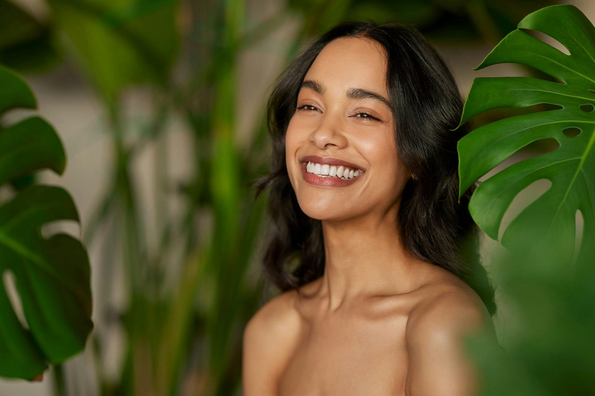Woman smiling in foliage