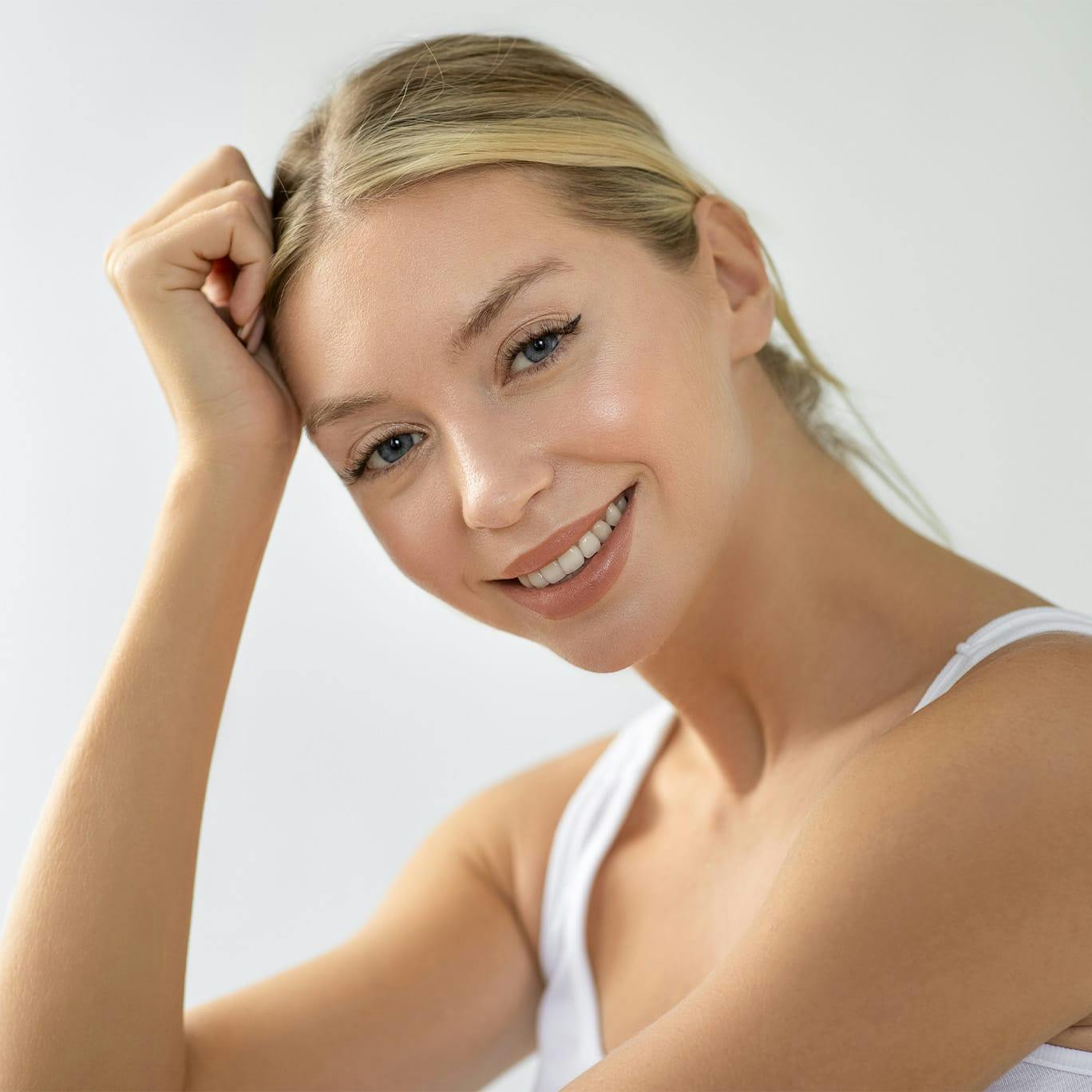 Blonde woman in white top
