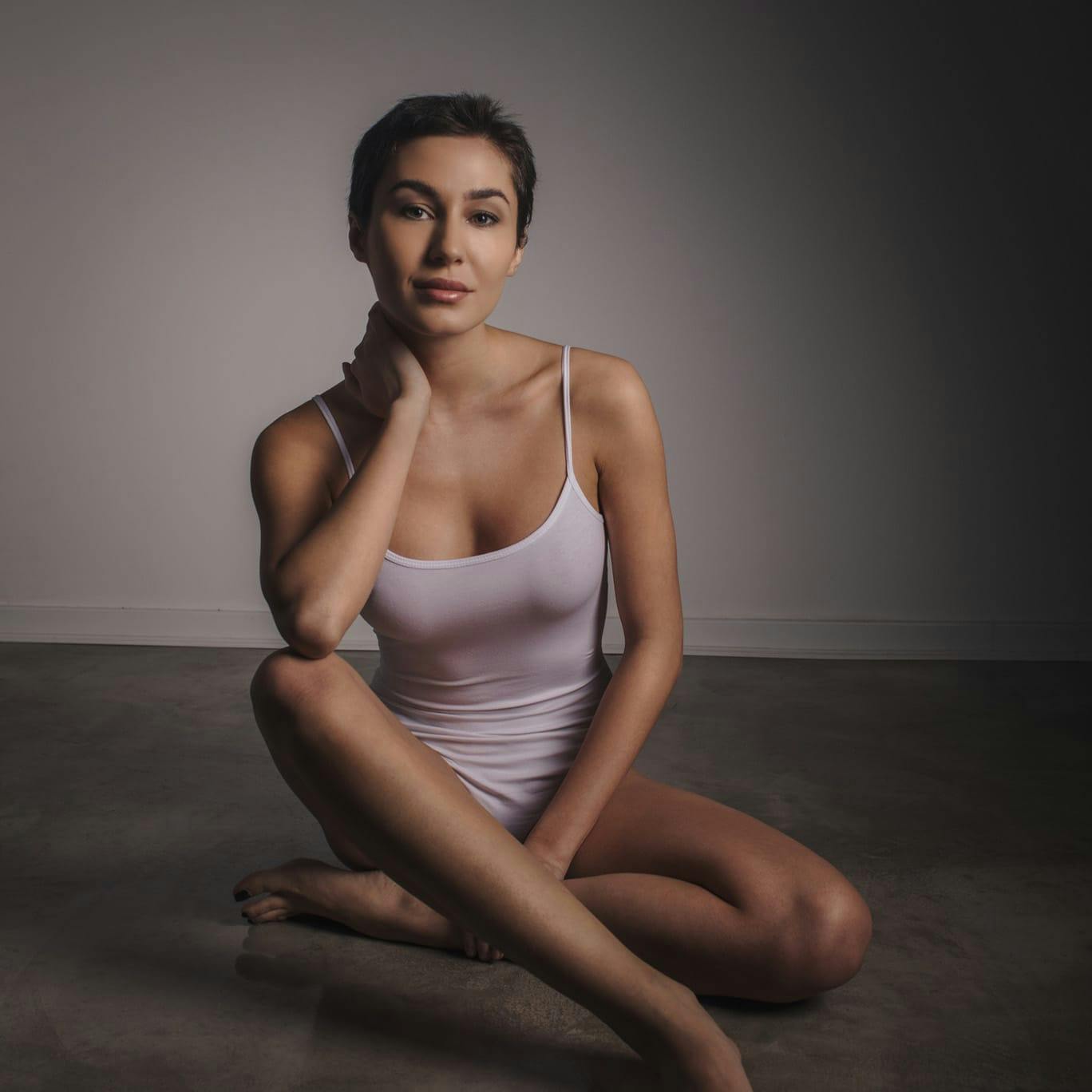 Woman in pink top sitting