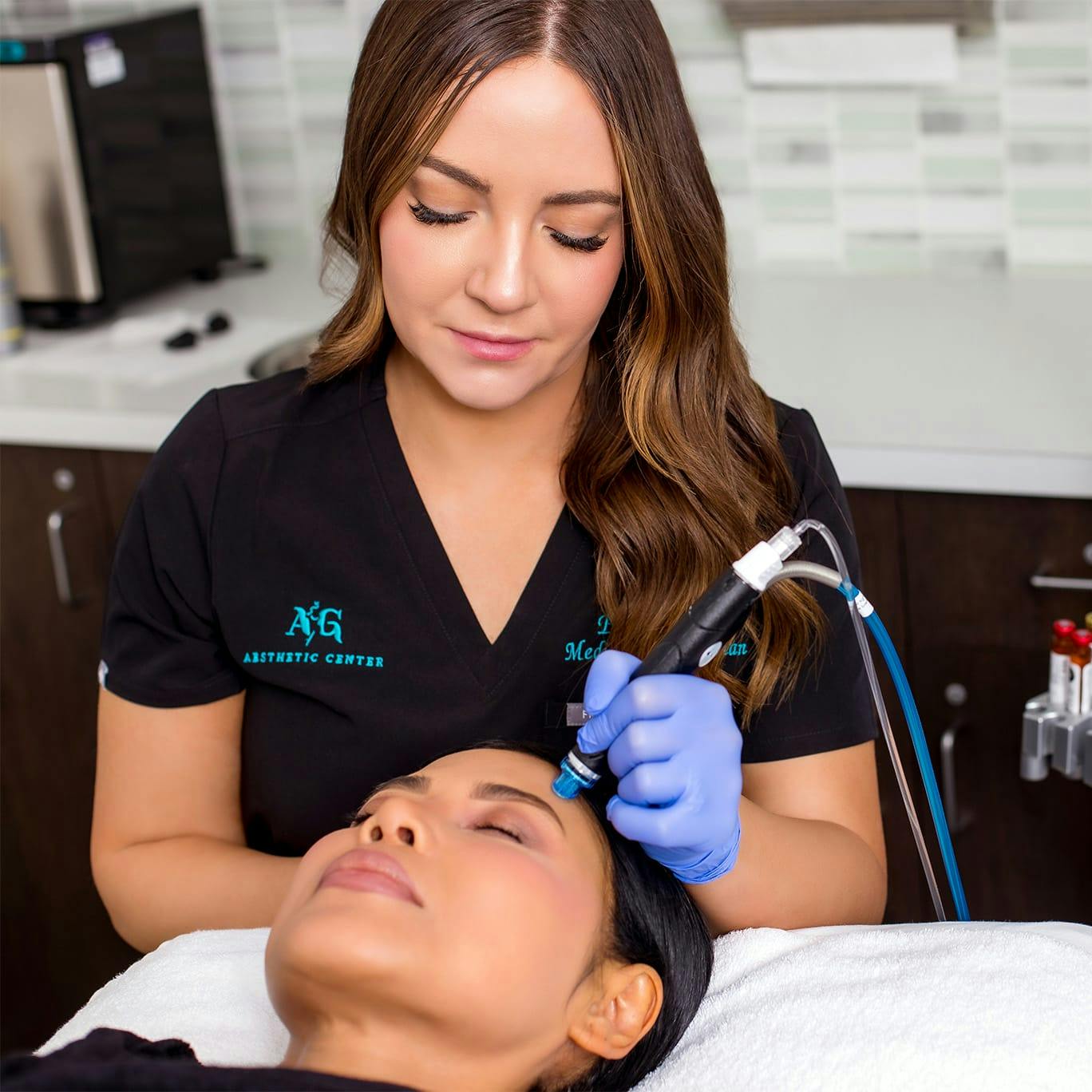 Practitioner administering skin pen treatment