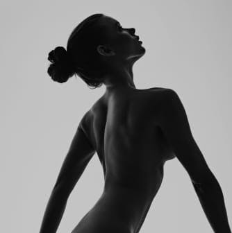 Silhouetted woman's back