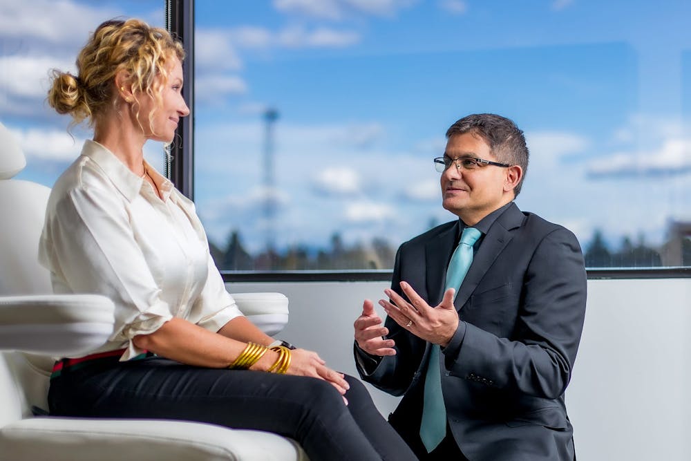 Dr. Allen Gabriel with a female patient