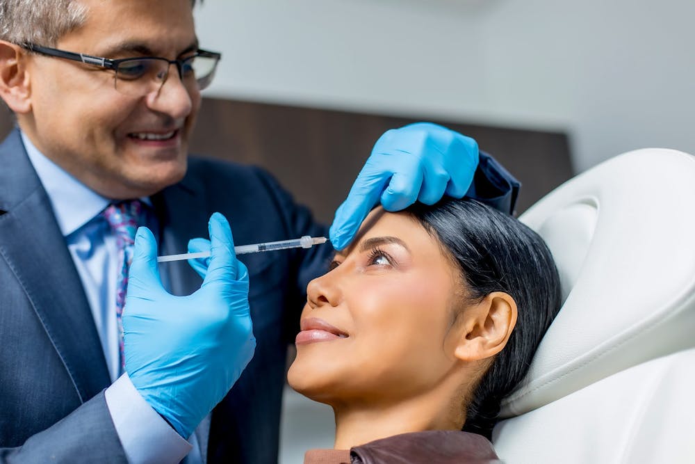 woman getting injectable treatment with Dr. Allen Gabriel