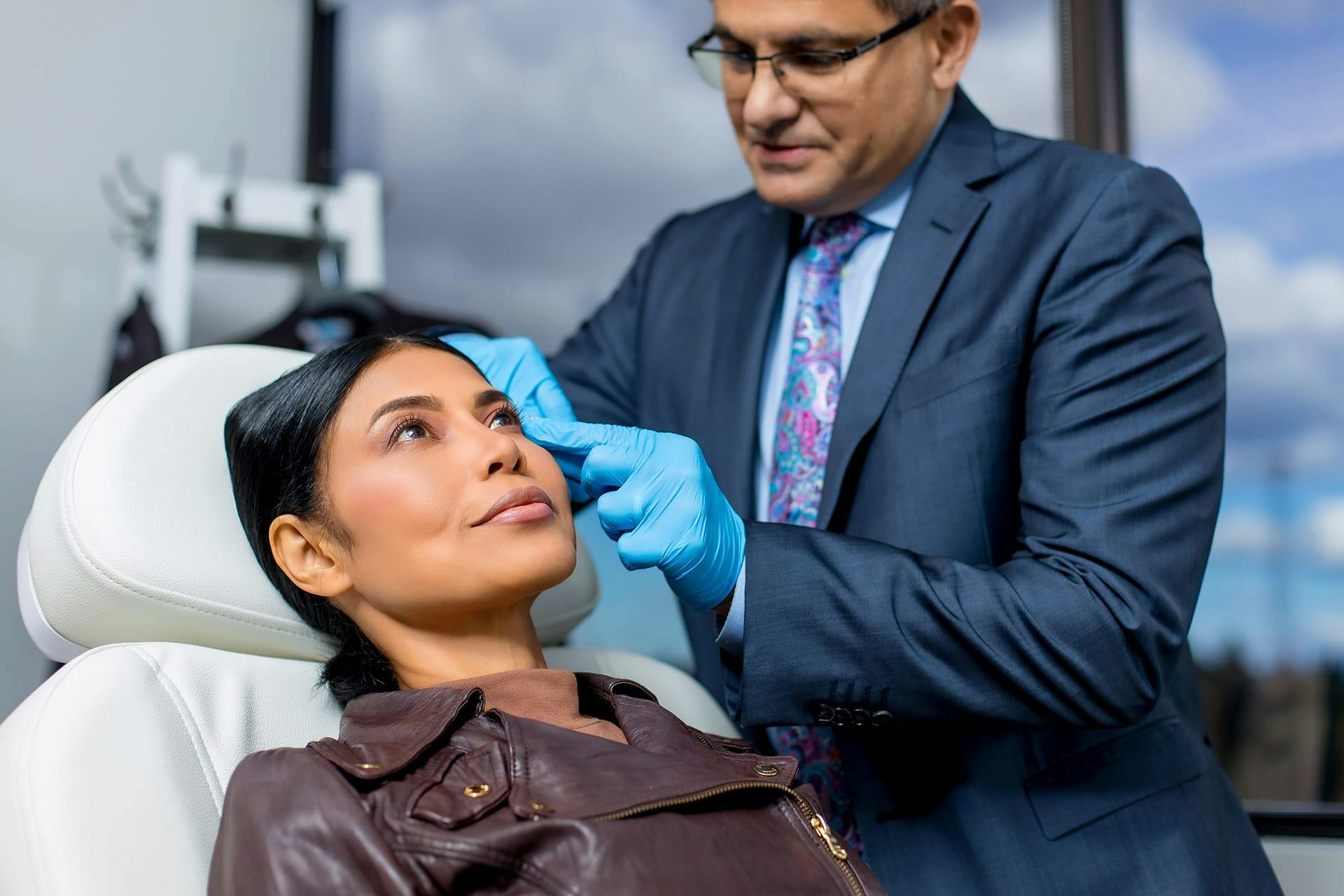 Dr. Allen Gabriel with a female patient
