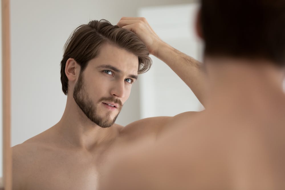 Man touching his hair