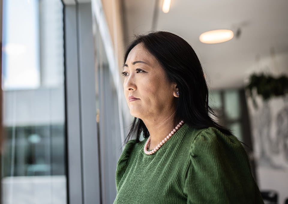 woman staring out the window