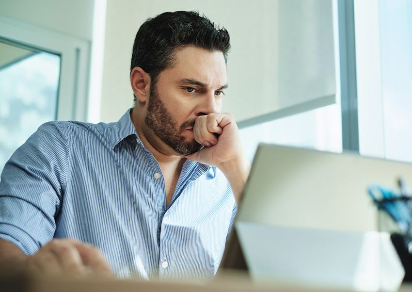 man looking at laptop