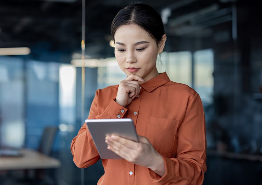 woman looking at ipad