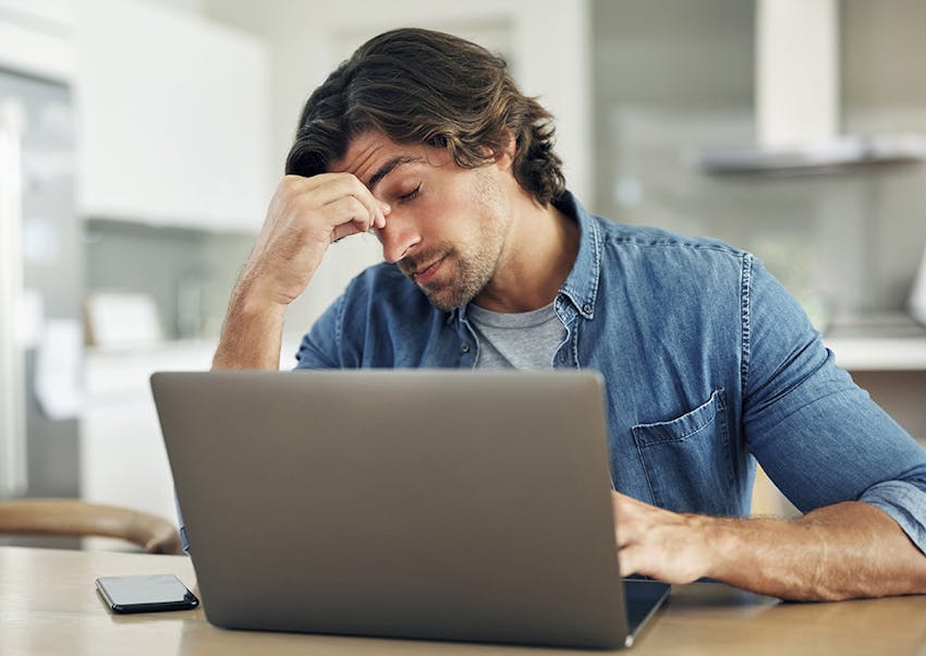 worried man on his laptop