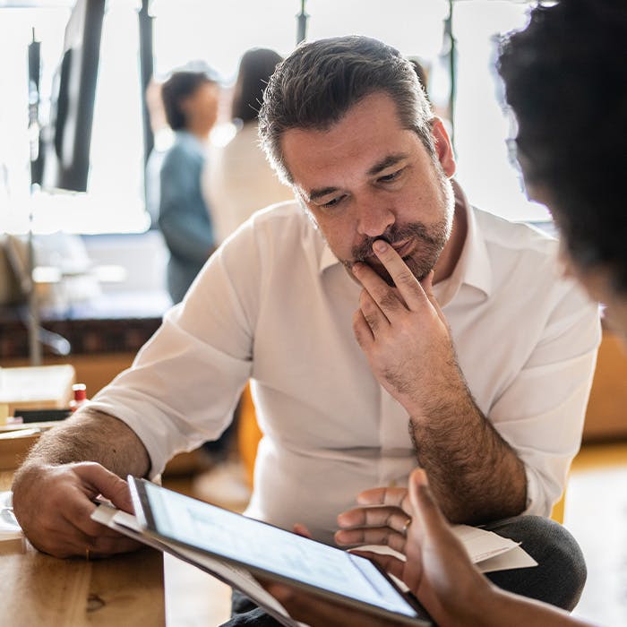 man looking at tablet
