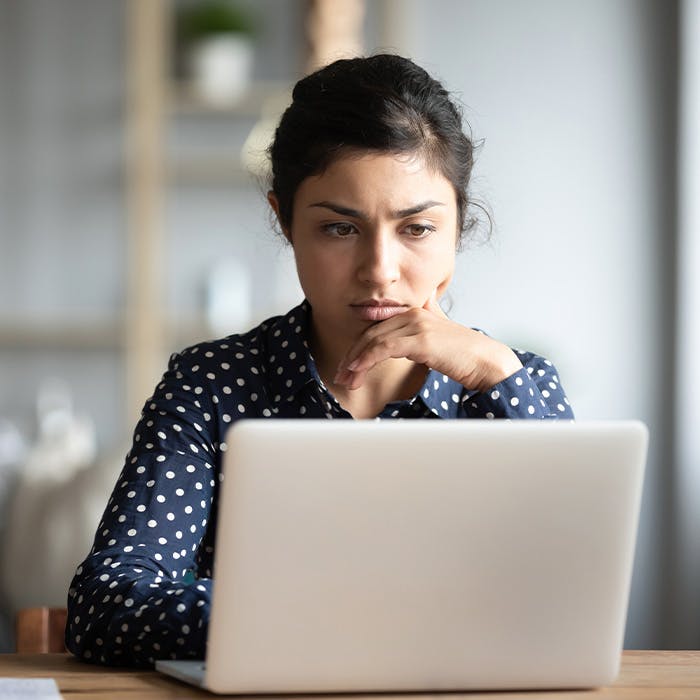woman looking at laptop
