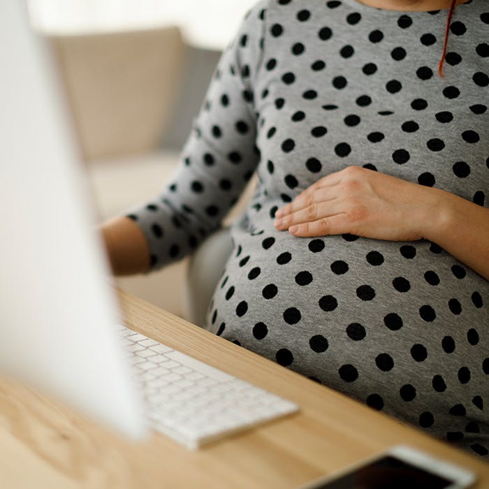 pregnant woman on the computer
