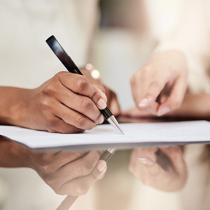 a person signing a document