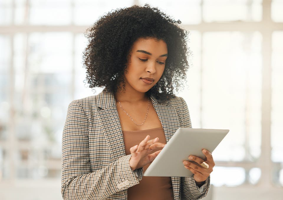 woman holding a tablet