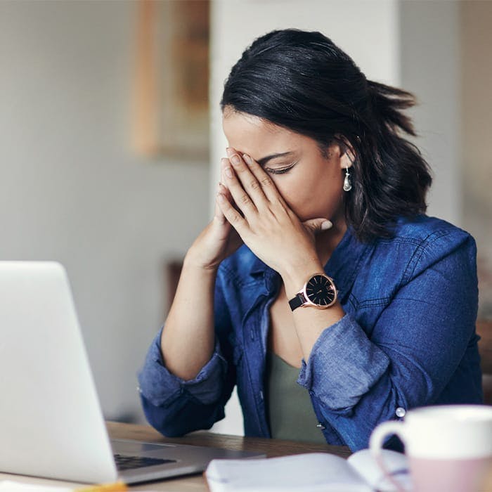 worried woman touching face