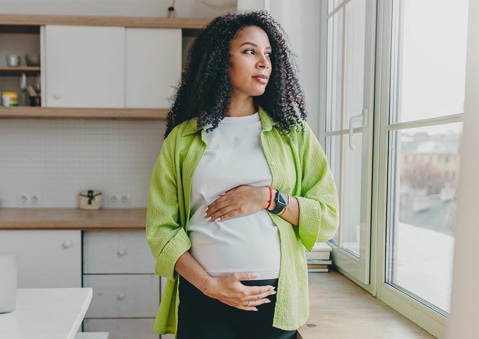 pregnant woman holding belly