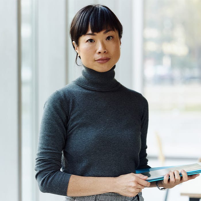 asian woman looking into camera