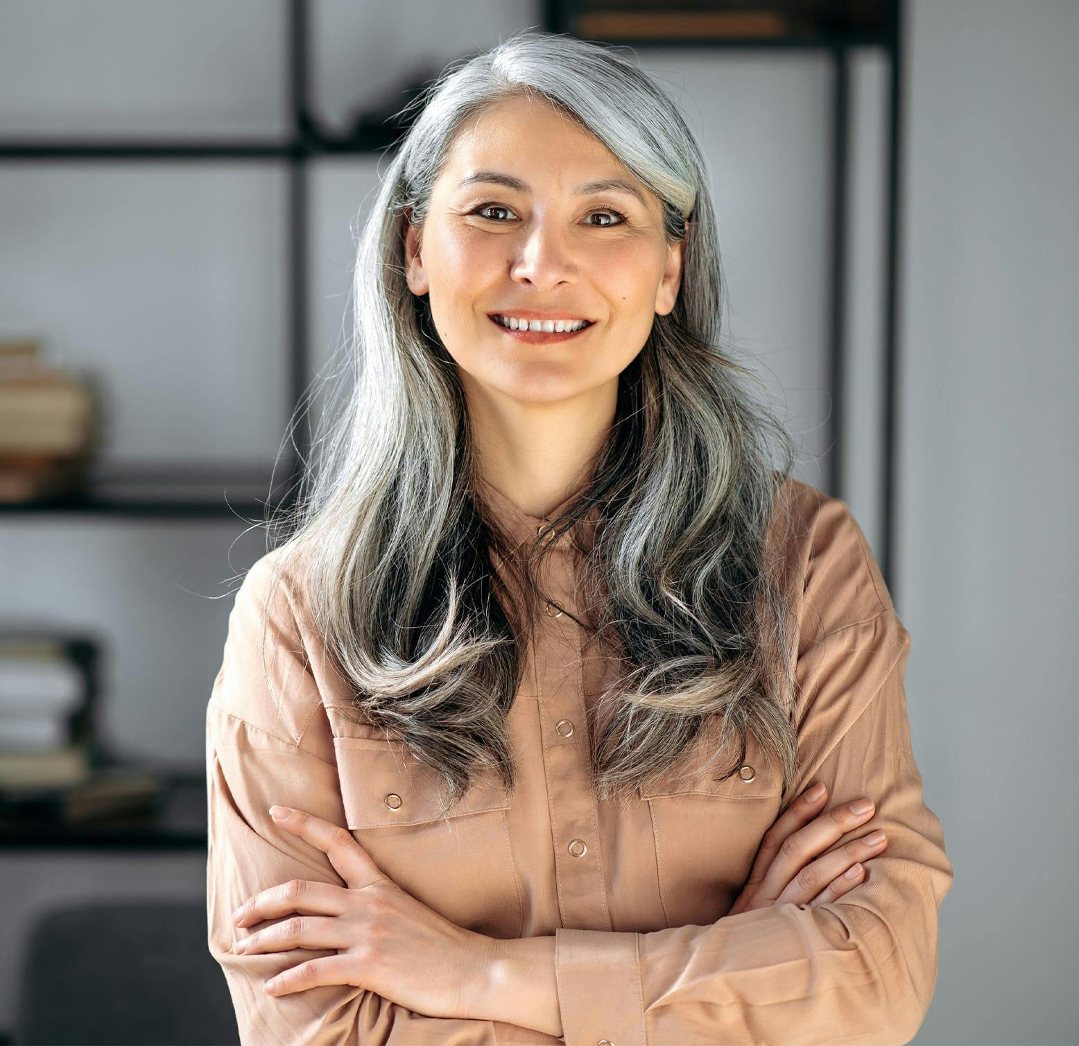 older woman crossing her arms