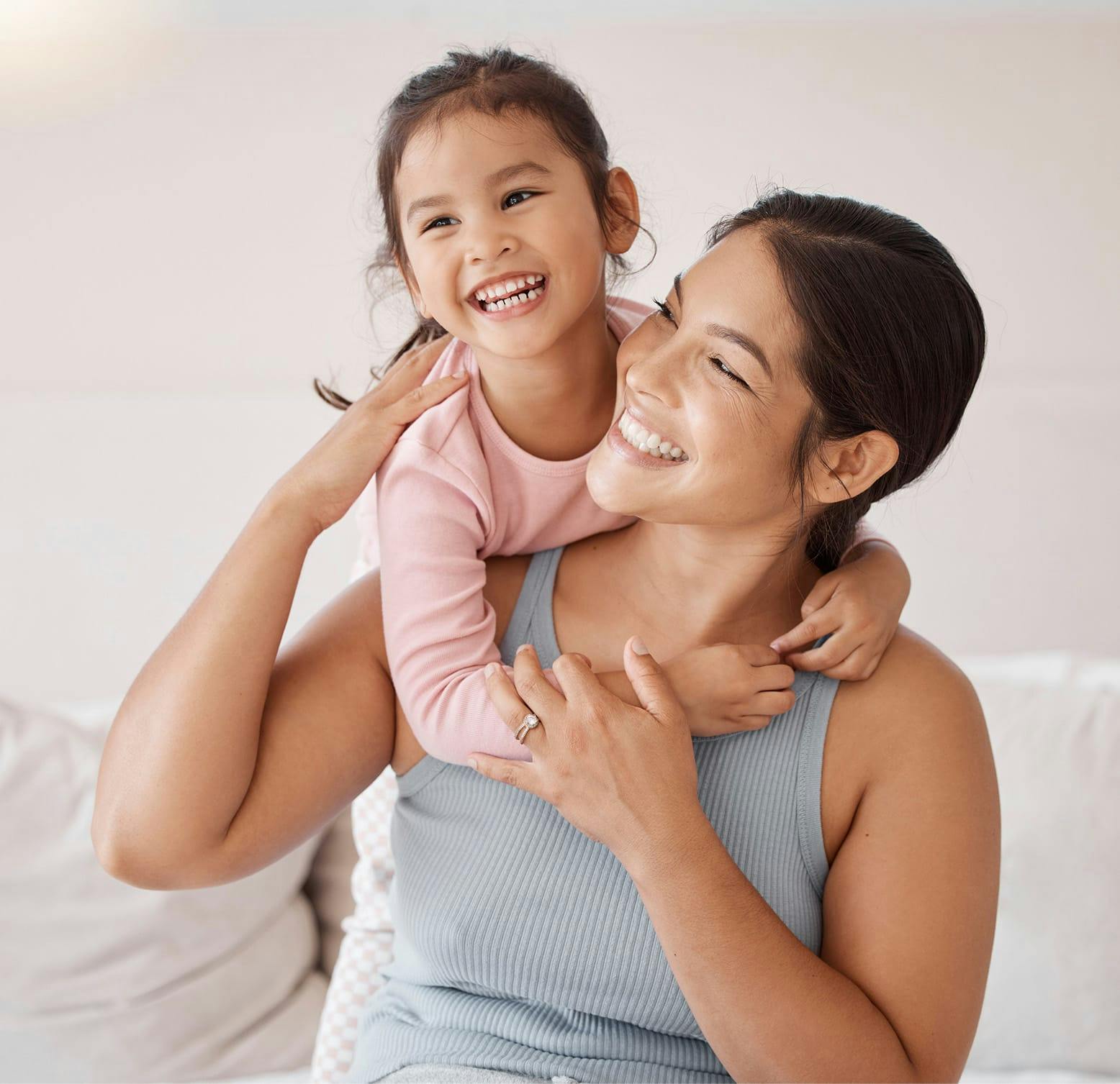 child hugging a woman