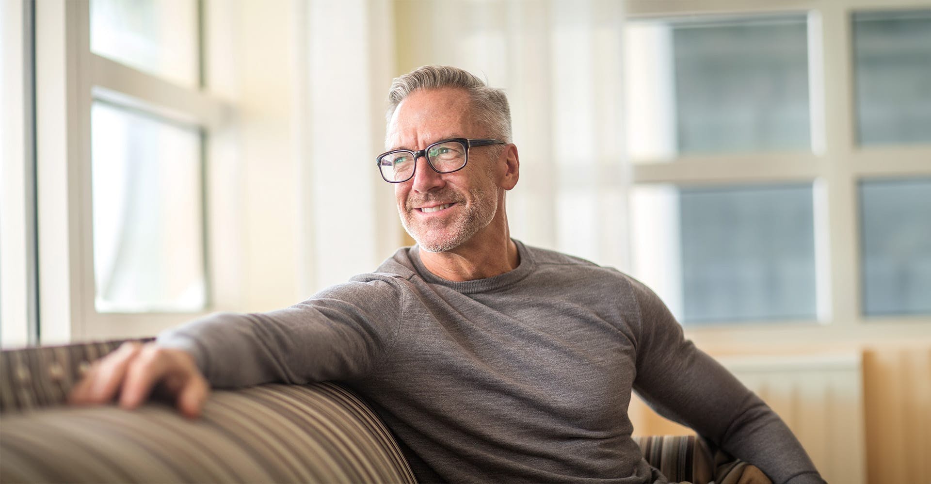 older man sitting on a couch