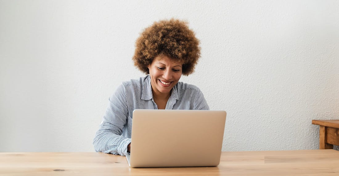 woman typing on a laptop