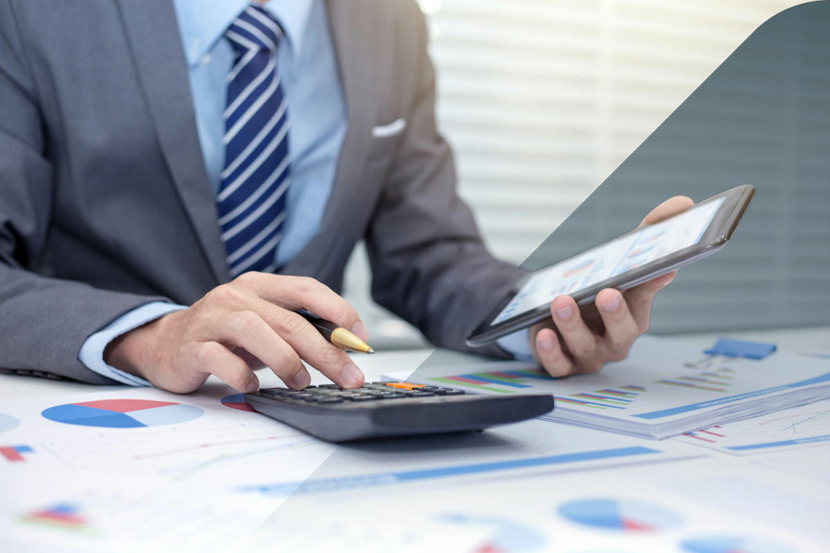 Male reviewing and calculating figures