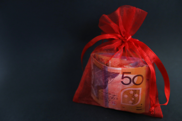 Australian dollars wrapped in a red pouch with a red ribbon.