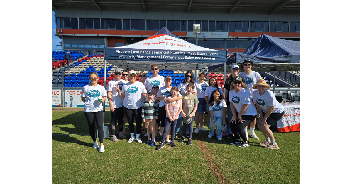 Gardian staff in front of the Gardian tent during the Mackay Hospital Foundation Family Fun Day 2025