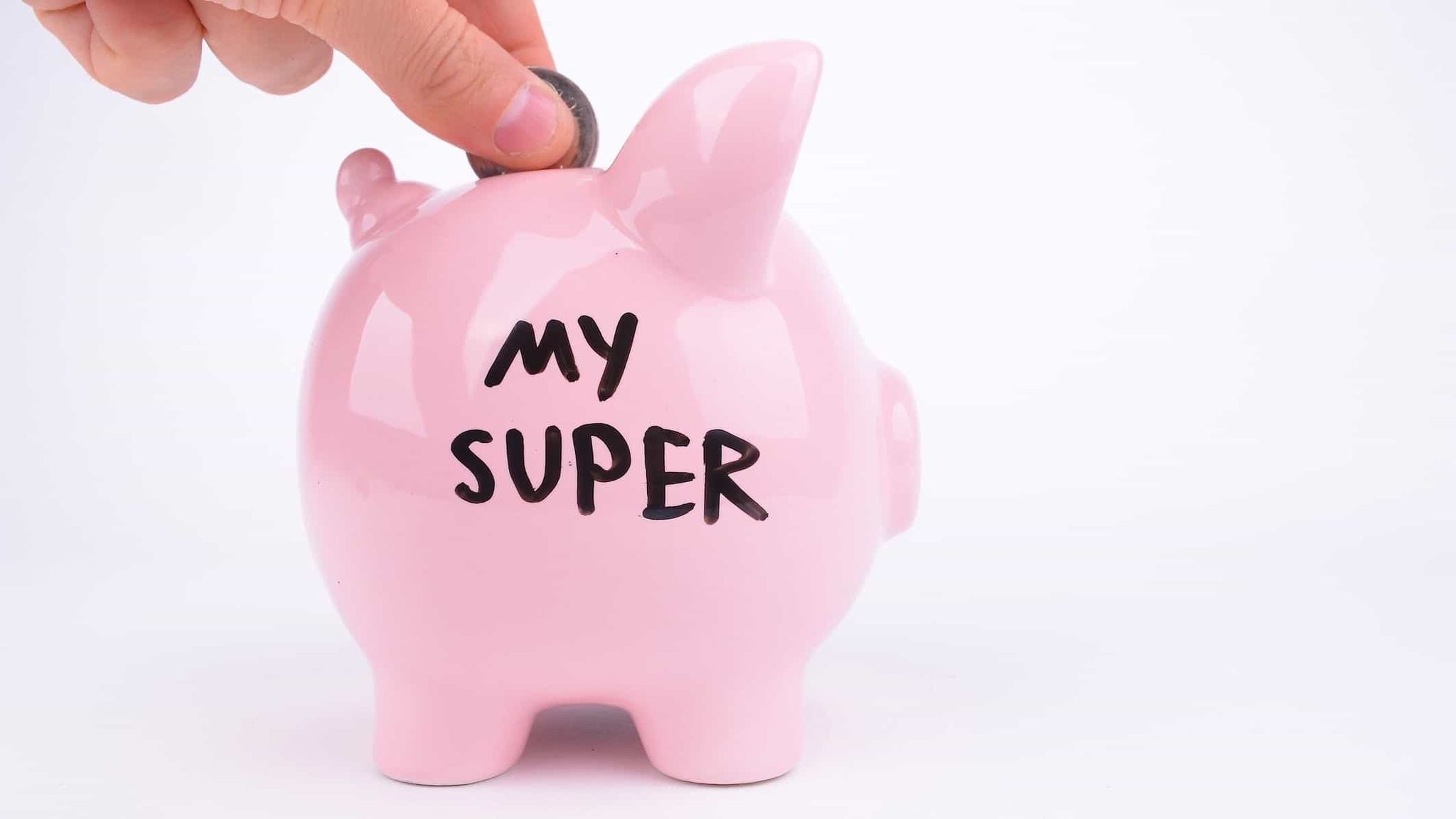 Piggy bank with a hand putting in a coin.  Used for the blog by Gardian Financial Planning in Mackay about "End of Financial Year Super Review"