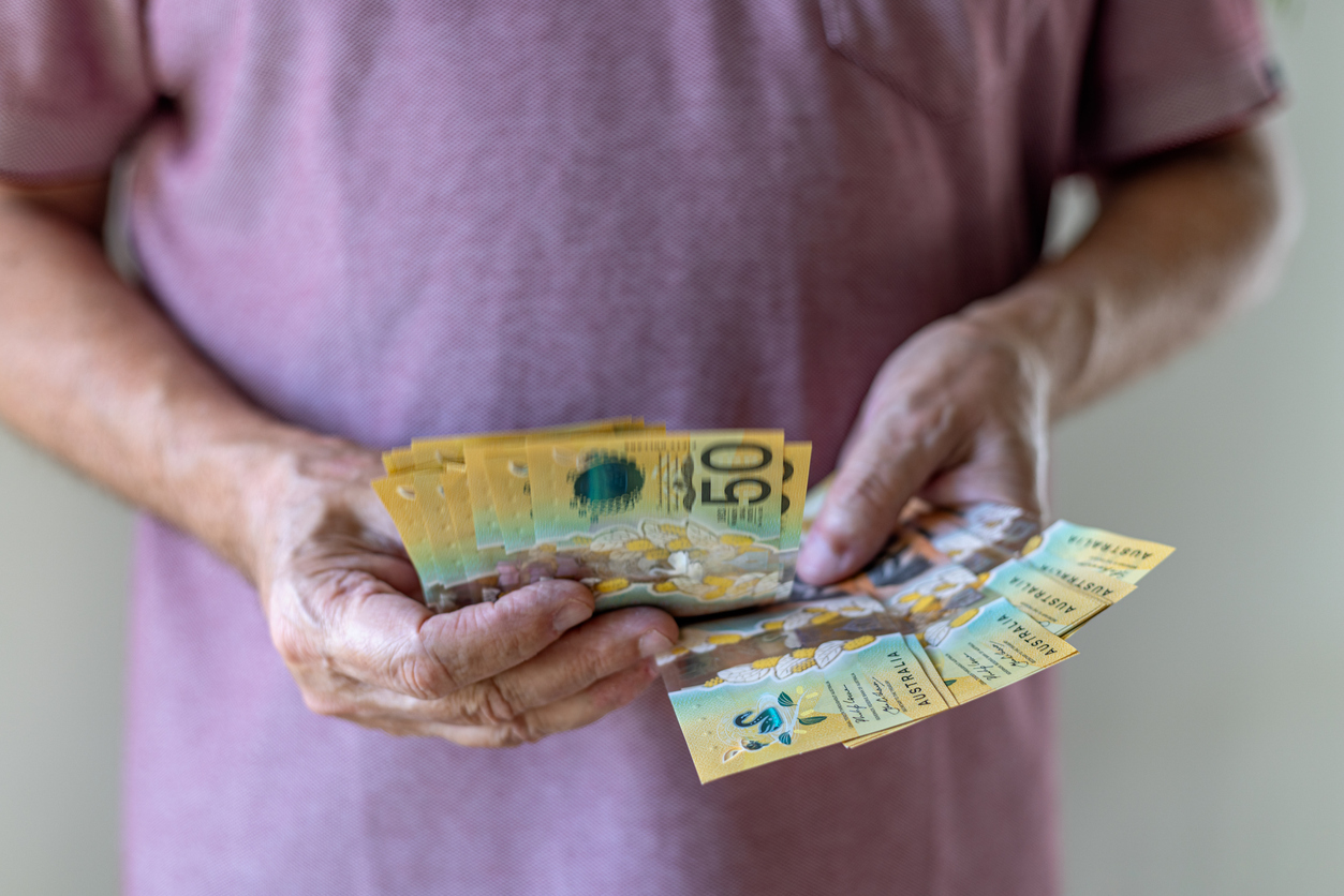 Man holding $50 Australian Dollars and this is used for the blog entitled 'In Control of Your Financial Future — or Just Coasting?'.