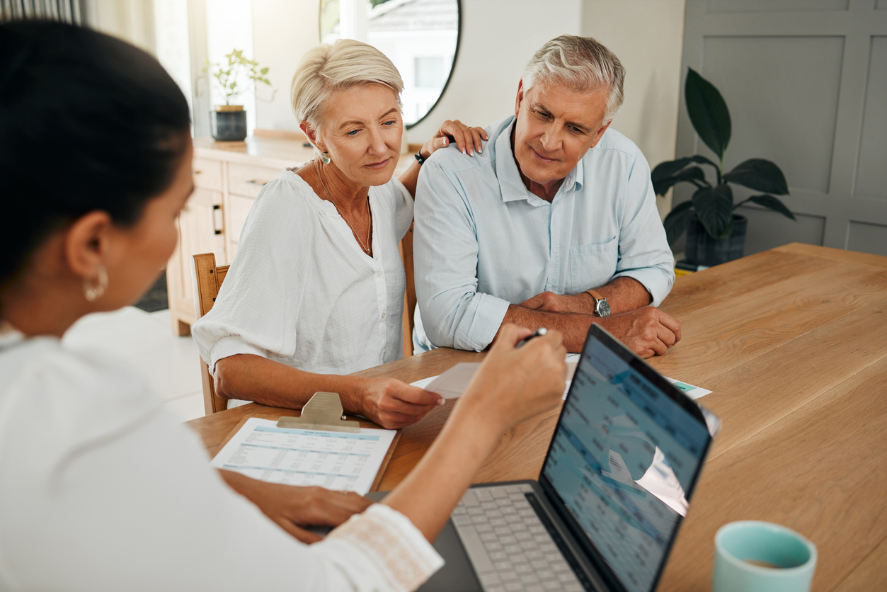 Financial advisor consultation with clients on retirement, finance planning or investment and document on laptop screen. Accountant woman, senior people and pension advice, asset management.