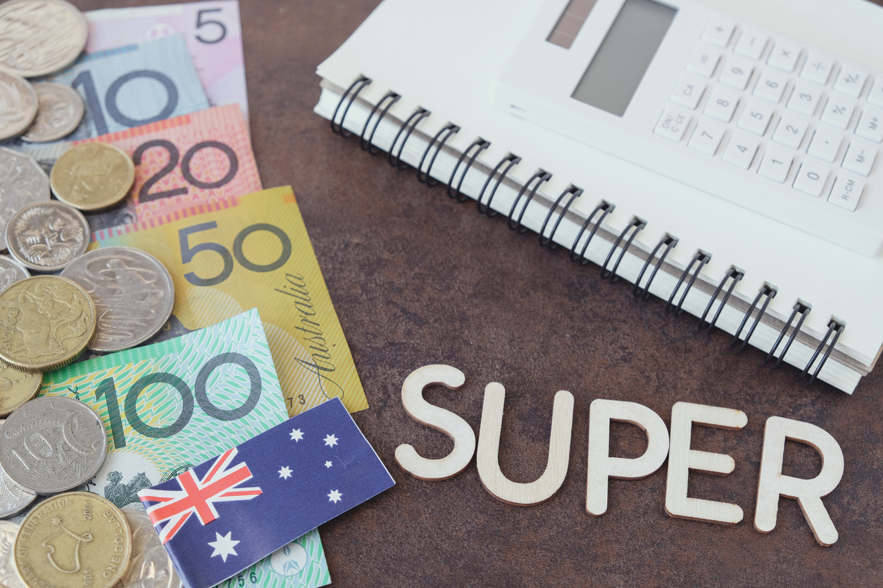 The word super with Australian bills and coins on the left side and a notebook and calculator on the right side.