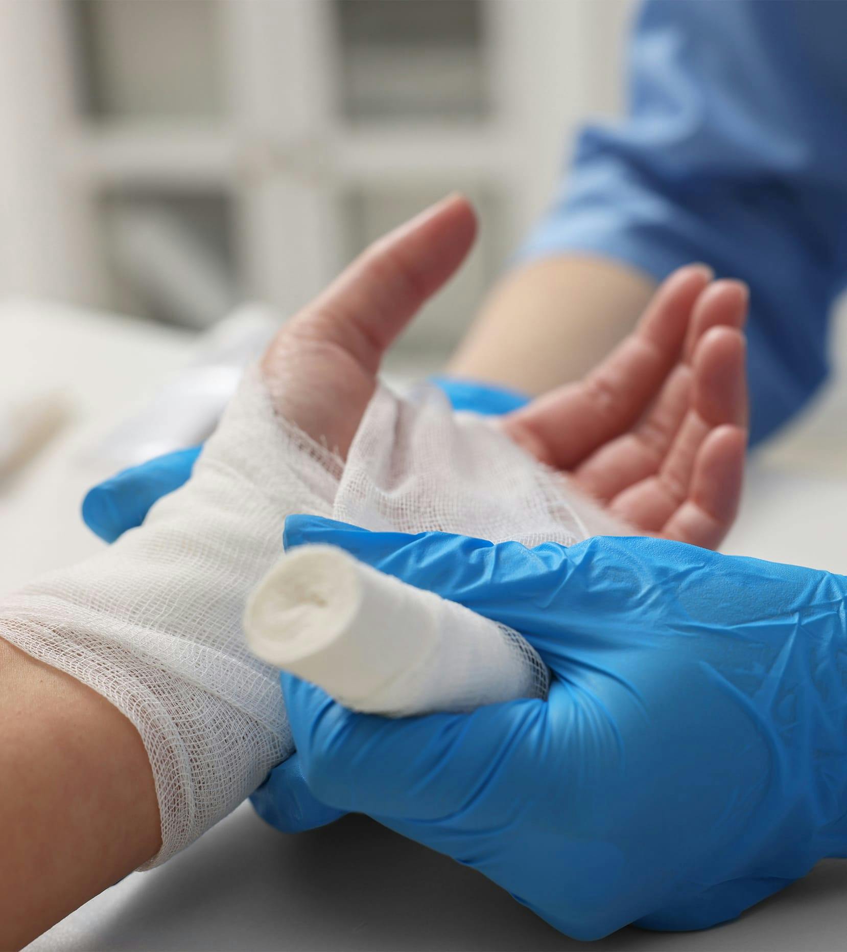 wrapping patient's hand